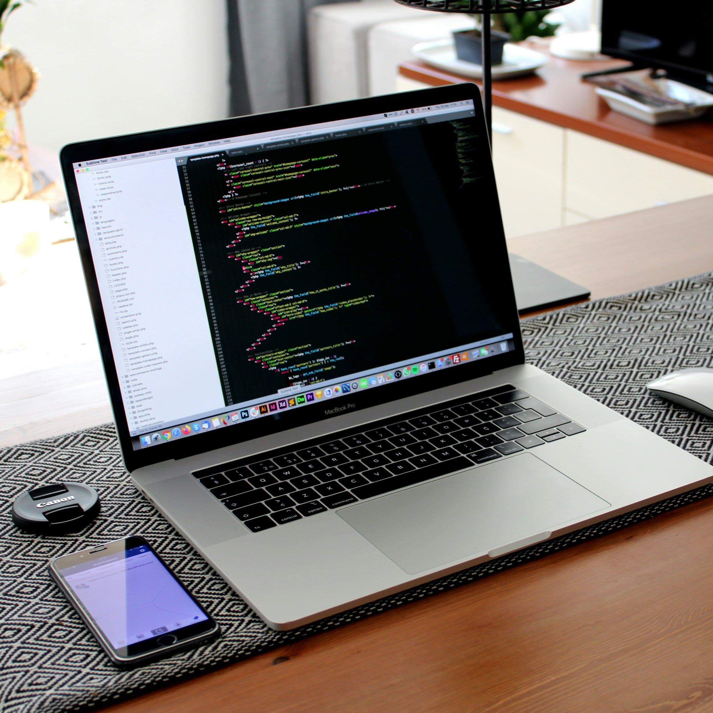 Professional home office setup with laptop, monitor, and organized workspace - representing productive remote work environment